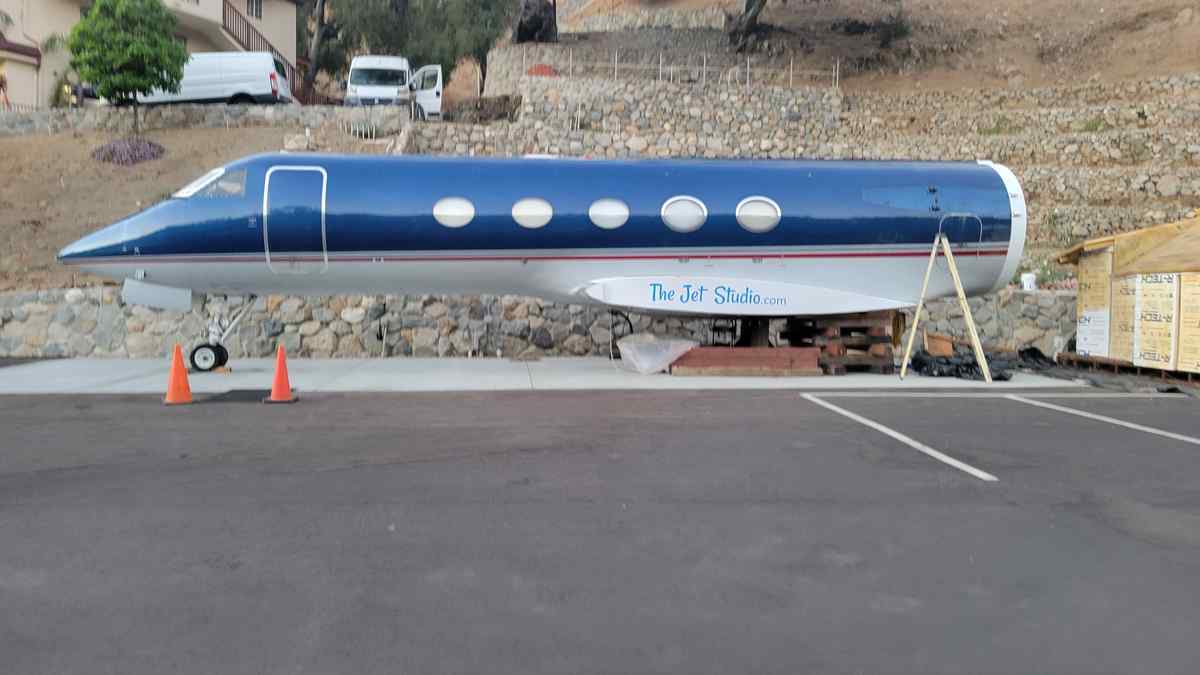 Gulfstream GIII mid-size executive jet. sitting on it's nose gear. Boarding stairs are hydraulic and can be remotely operated